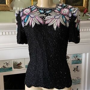 Vintage Stenay beaded top steps right out of the 80’s complete w/ shoulder pads.